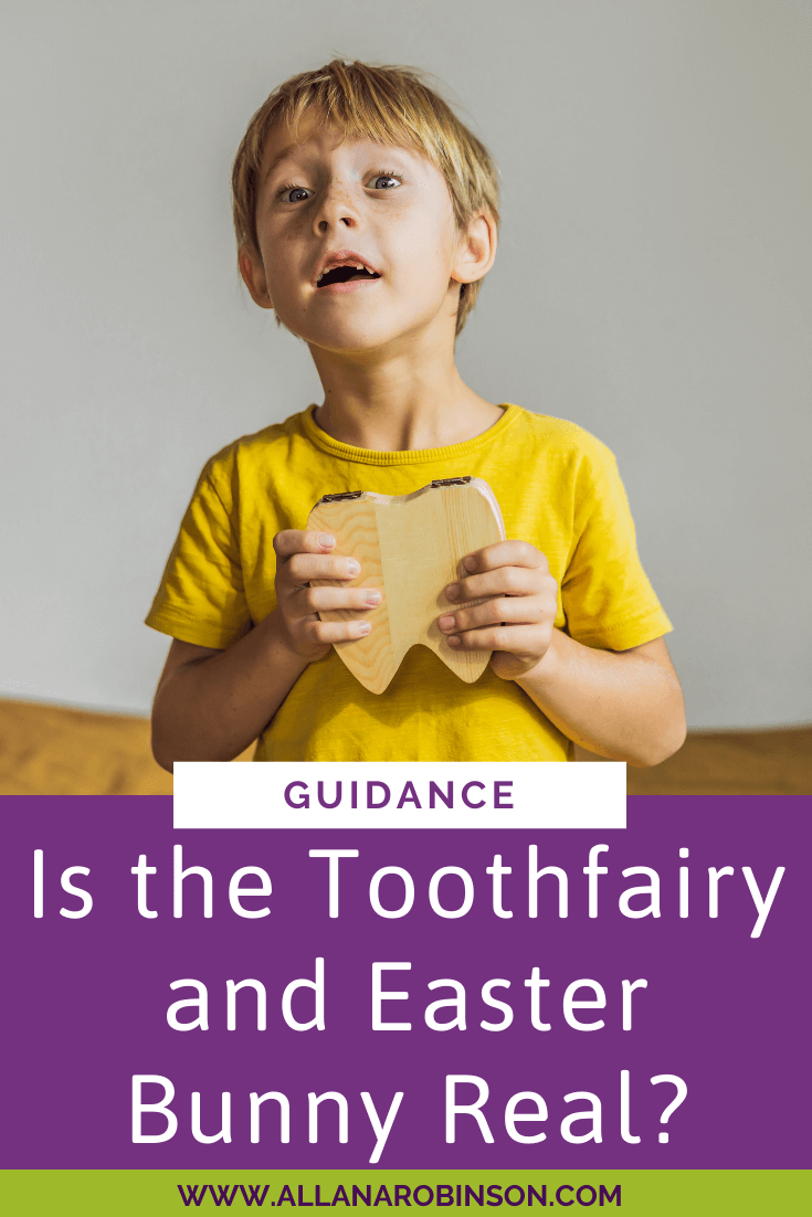 Is the Easter Bunny or Tooth Fairy Real? Child holding a cardboard heart.