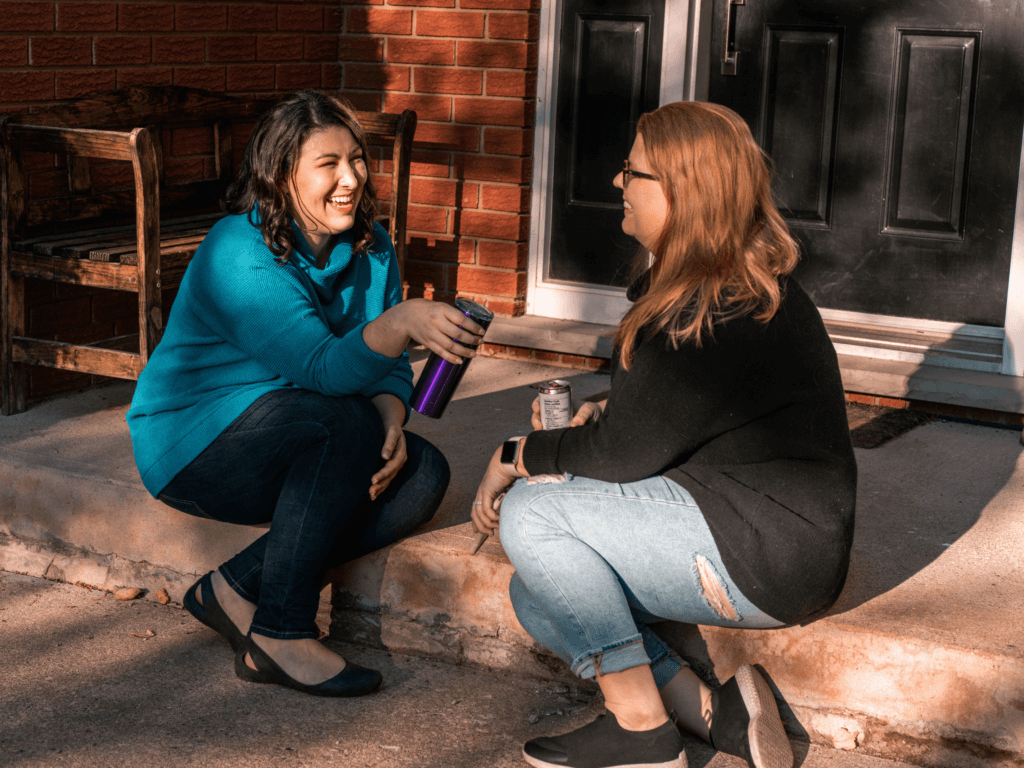 Moms getting parenting coaching outside.